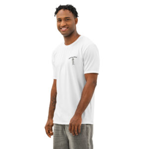Man wearing white t-shirt, gray pants, smiling.
